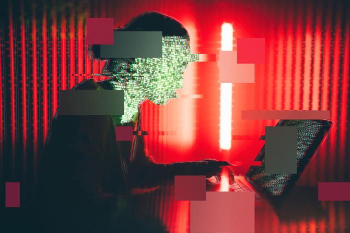 What’s Powering Enterprise AI in 2025: ThreatLabz Report Sneak Peek woman working illuminated by laptop AI