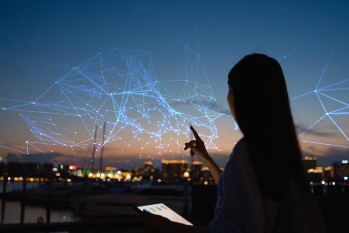 Woman touching at a digital web Embracing the Future of Zero Trust Administration with ZIdentity and Experience Center