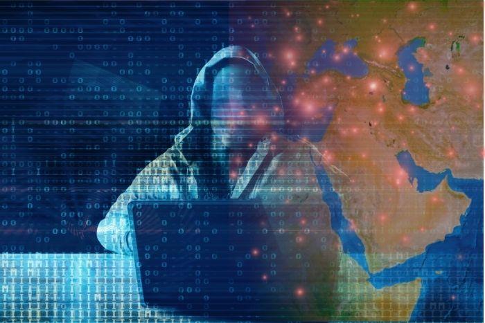 Targeted Attack on Government Entities in the Middle East | Part 1 A hacker with a map of the Middle East in the background.