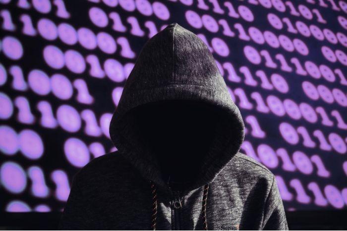 CaptiveCrunch: Midnight Blizzard Weaponizes Hotel Wi-Fi Captive Portals to Steal Microsoft 365 Credentials A hacker sitting in front of a digital binary-like background