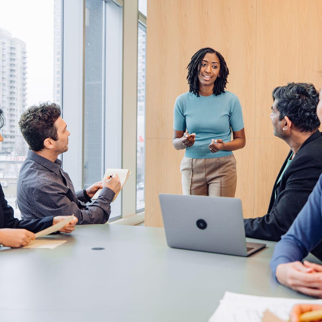 A small group of people discussing the different between DSPM, CSPM and SSPM