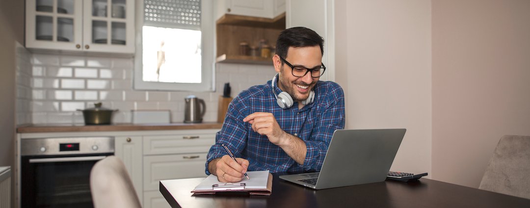 A man working from home on a laptop