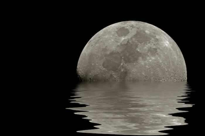 MoonWalk: A deep dive into the updated arsenal of APT41 | Part 2 A large glowing moon reflecting over a body of water.